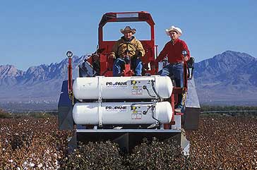 Operation of an experimental thermal defoliator for cotton. (USDA-ARS photo by Peggy Greb)